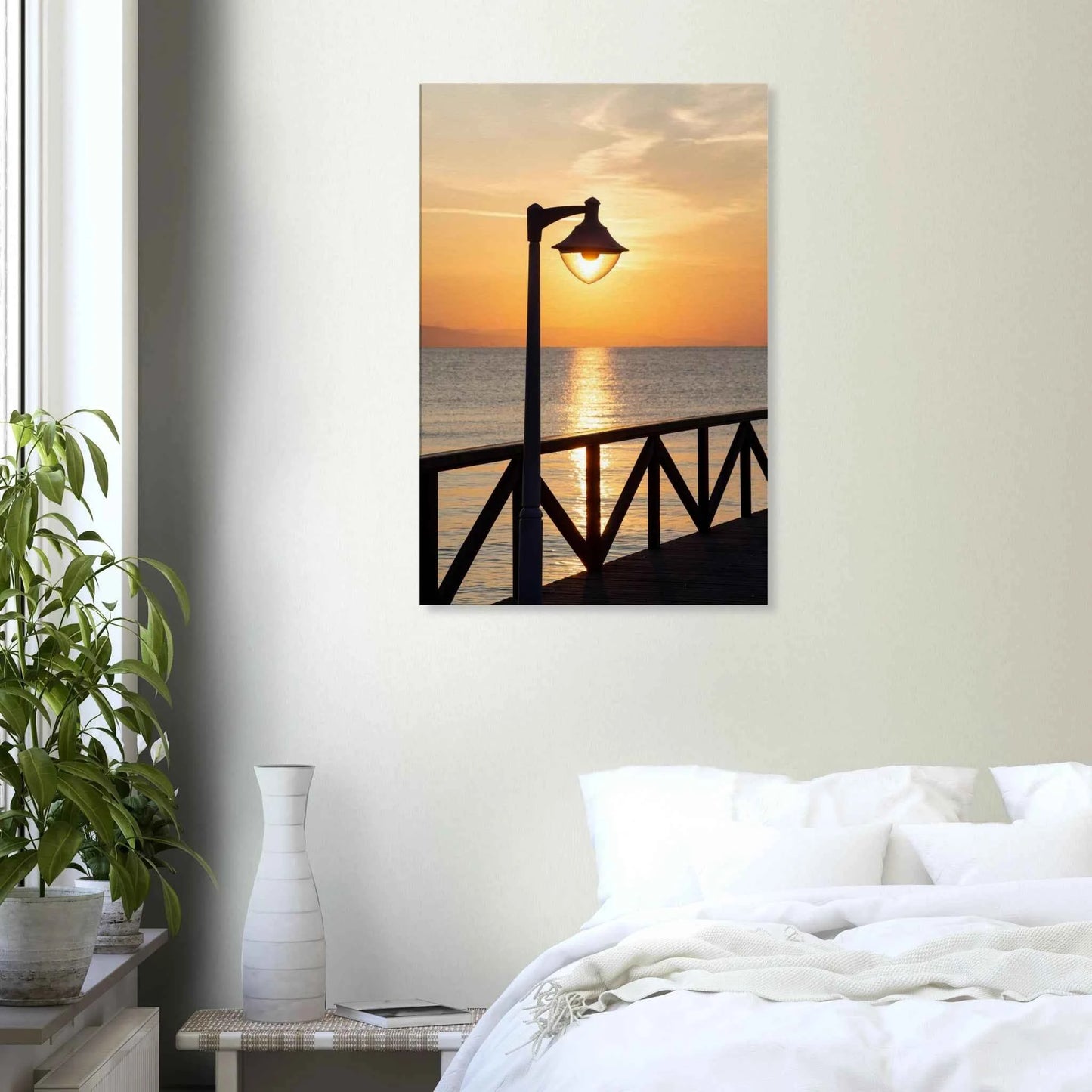 Canvas print wall art of a sunset over the sea with a street lamp on the pier on the wall in the Bedroom