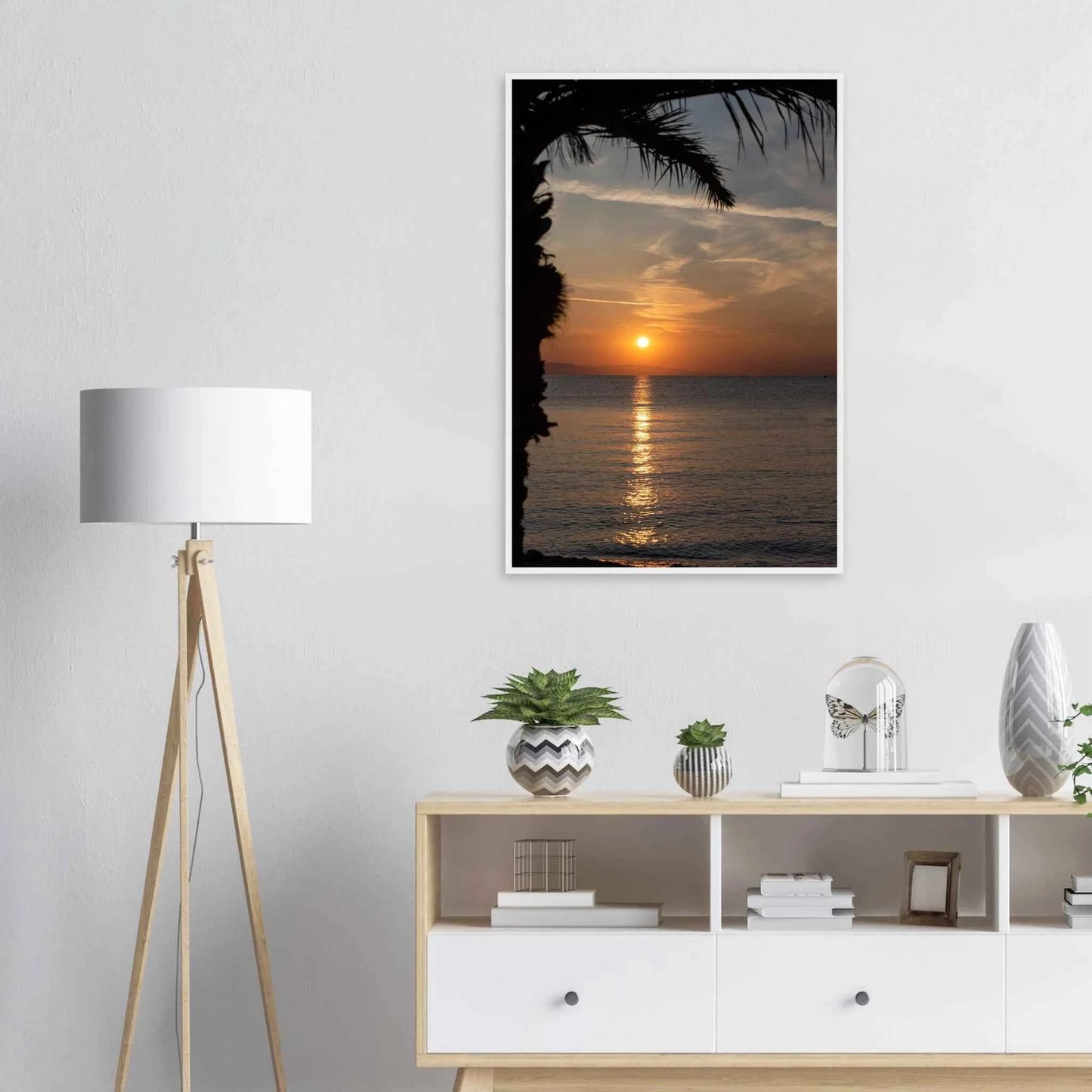 Wooden framed wall art Sunset over calm water with golden reflections, framed by tree branches in a peaceful natural landscape on the wall in the Bedroom