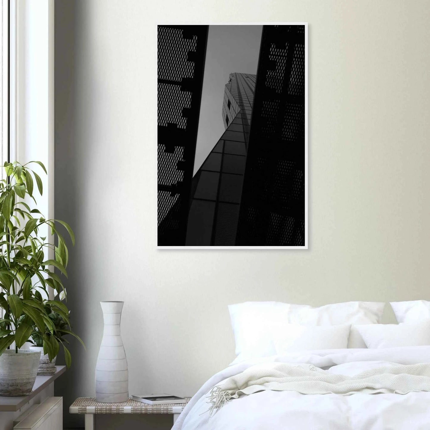 Black and white Low angle view looking up at a tall glass skyscraper framed between two metal structural elements on Wooden frame wall art on the wall in the Bedroom