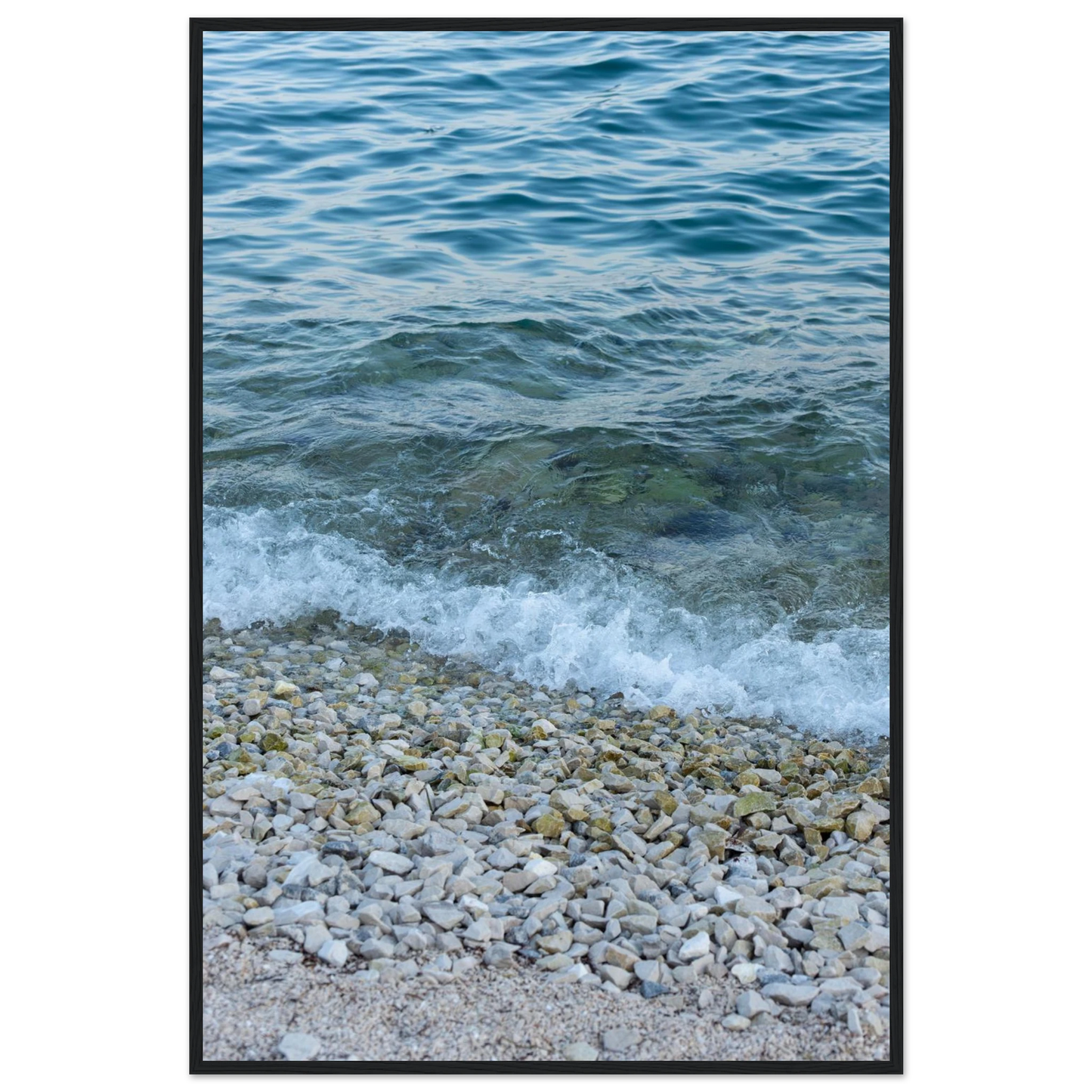 Aerial view ocean beach with wood frame, top down drone shot of blue sea foam and pebbles