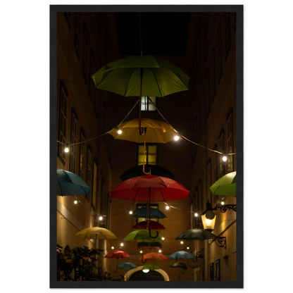 Nighttime street scene with colorful illuminated umbrellas hanging as decoration above a vibrant outdoor area on a wooden frame wall art