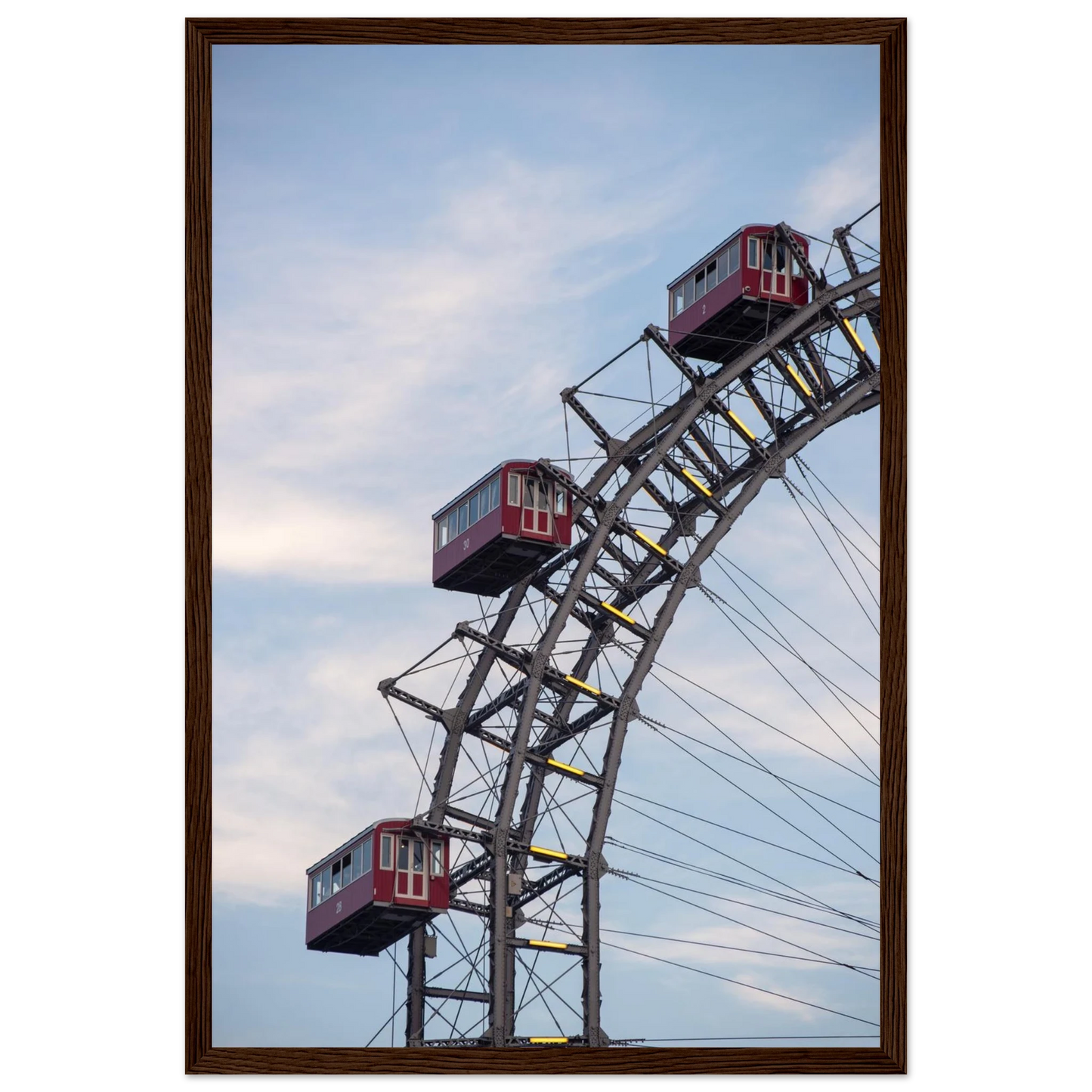 Close up of the historic Vienna Prater Giant Ferris Wheel (Wiener Riesenrad) showing its iconic steel structure and vintage mechanical details on wooden framed wall art