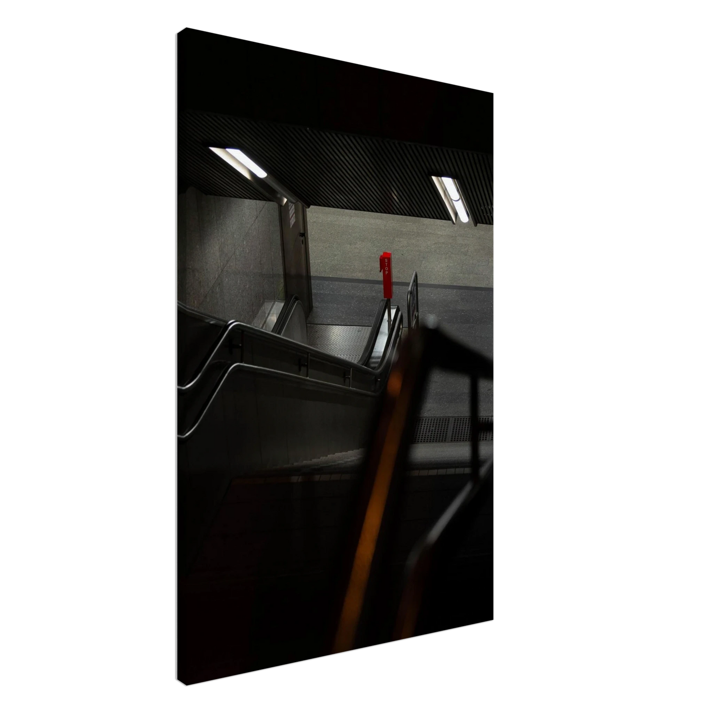 Nighttime view of a metro station entrance with illuminated signs and dark urban surroundings on Canvas print wall art