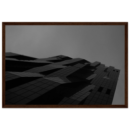 Black and white low angle view of a modern skyscraper with bold geometric lines and dark textured facade on wooden framed wall art
