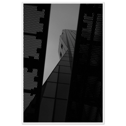 Black and white Low angle view looking up at a tall glass skyscraper framed between two metal structural elements on Wooden frame wall art