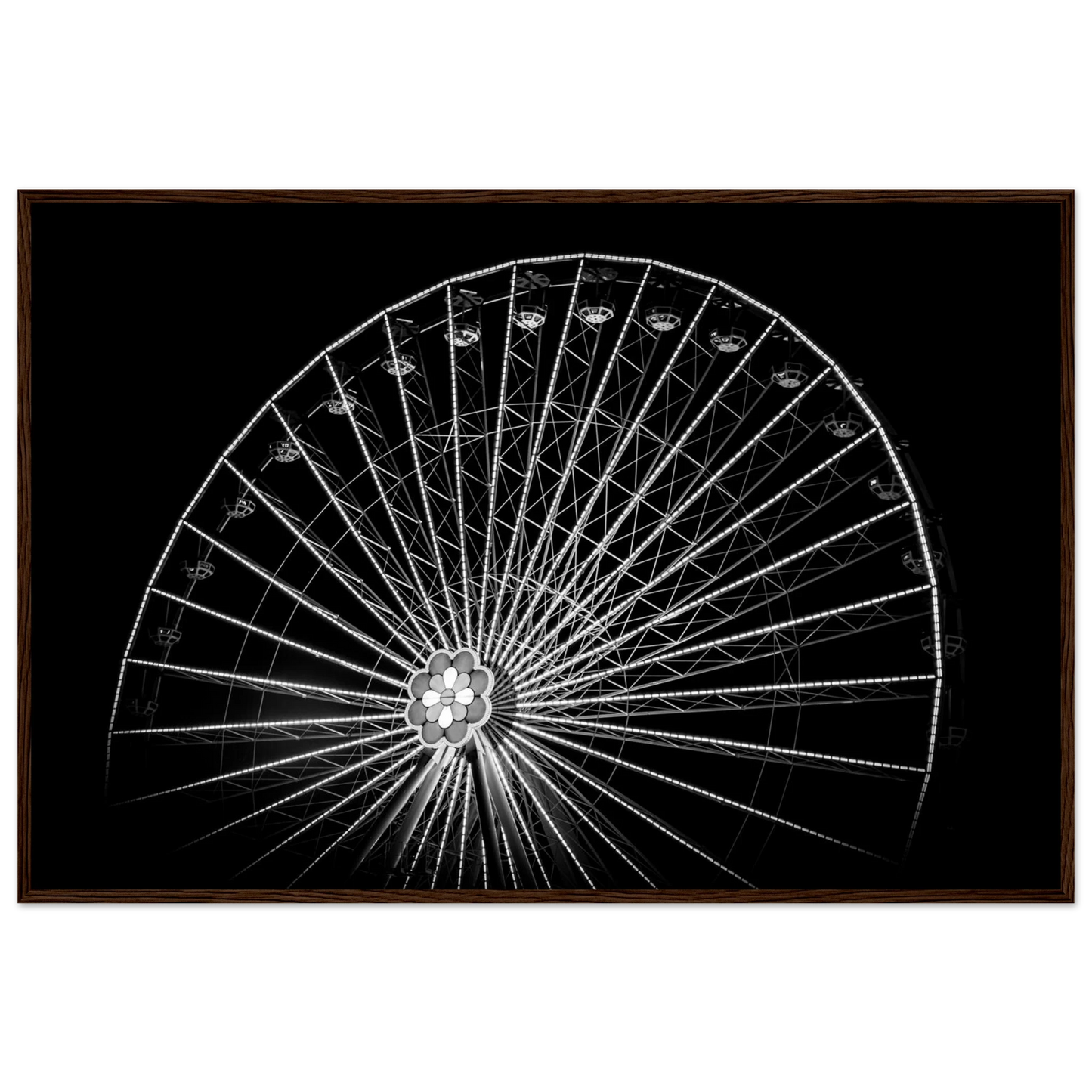 Black and white night photo of the Vienna Prater Giant Ferris Wheel (Wiener Riesenrad) with illuminated spokes forming a circular pattern against the dark sky on wooden framed wall art