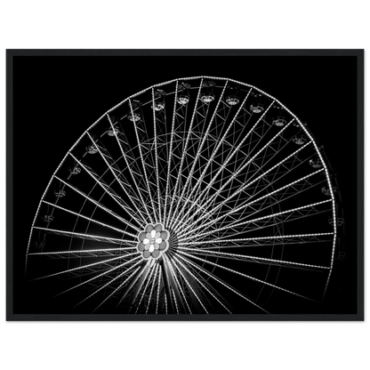 Black and white night photo of the Vienna Prater Giant Ferris Wheel (Wiener Riesenrad) with illuminated spokes forming a circular pattern against the dark sky on wooden framed wall art