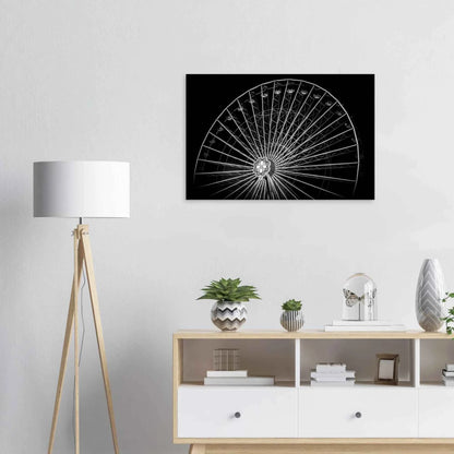 Black and white night photo of the Vienna Prater Giant Ferris Wheel (Wiener Riesenrad) with illuminated spokes forming a circular pattern against the dark sky on Canvas Print wall art on the wall in the Livingroom