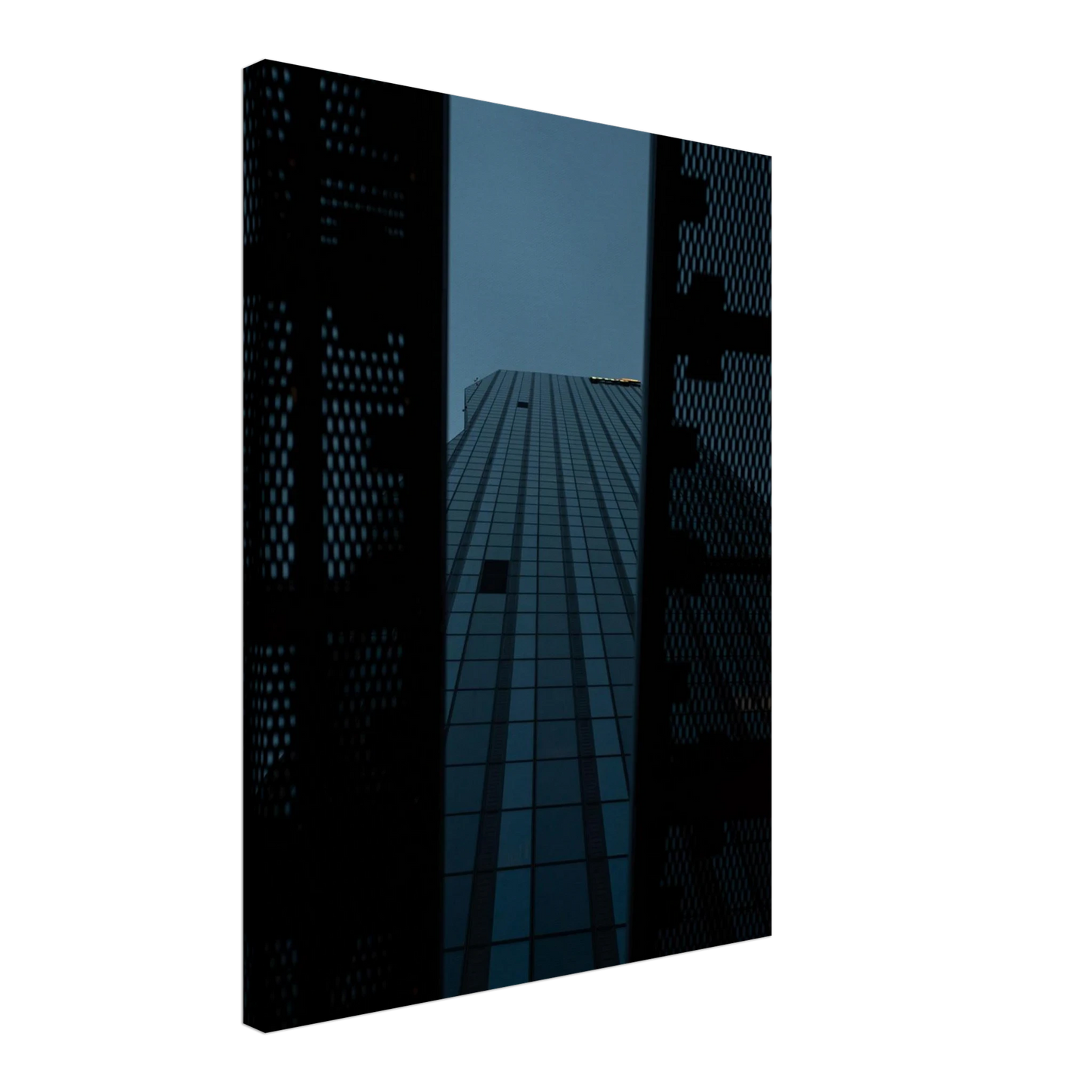 Low angle view looking up at a tall glass skyscraper framed between two metal structural elements on Canvas Print wall art