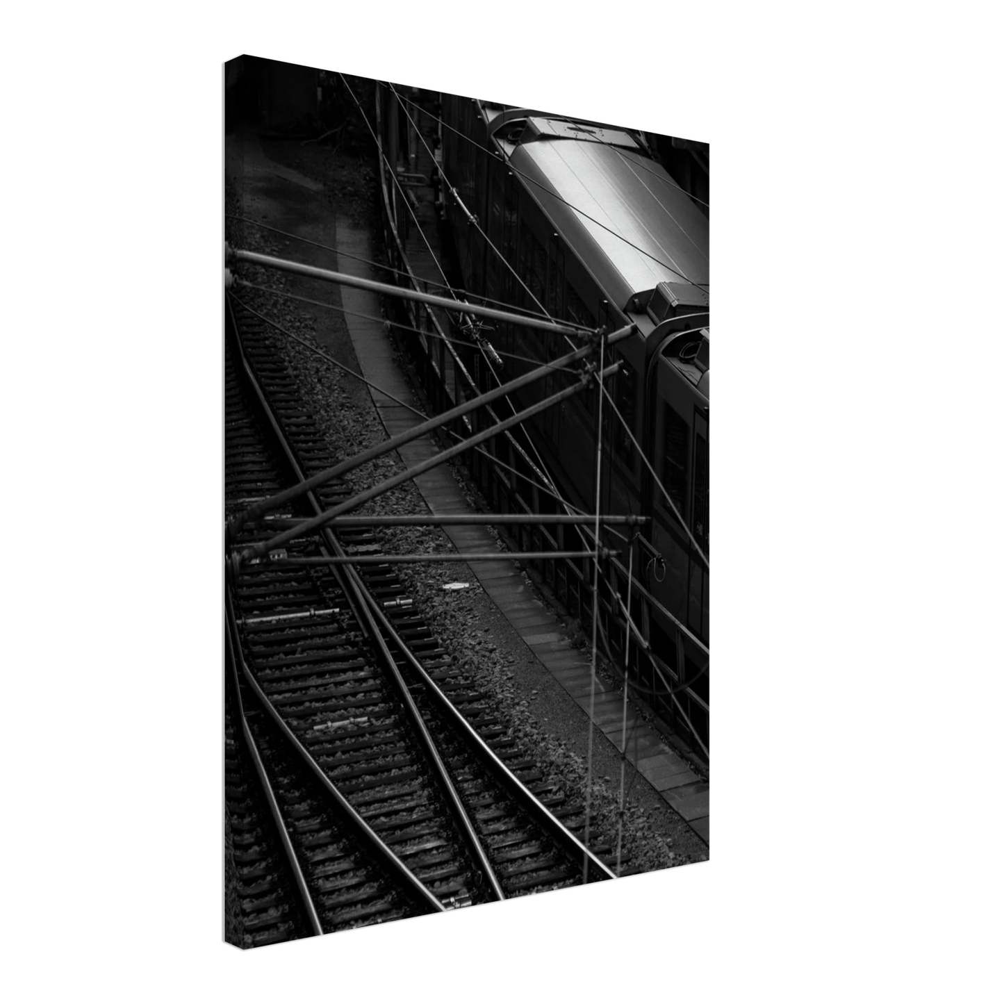 Black and white aerial view of metro train and railway tracks in an urban underground or elevated rail system on Canvas Print wall art on the wall in the Livingroom