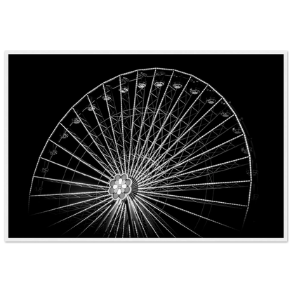 Black and white night photo of the Vienna Prater Giant Ferris Wheel (Wiener Riesenrad) with illuminated spokes forming a circular pattern against the dark sky on wooden framed wall art