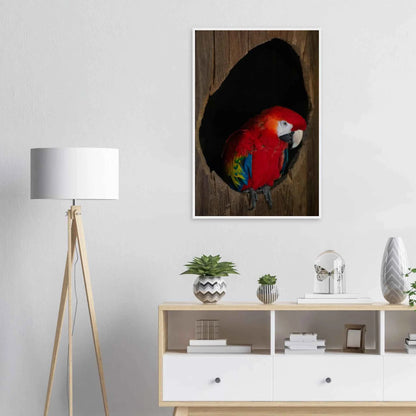 Wooden framed wall art featuring a close-up of a red, blue, and yellow Parrot in a dark wooden nest hole on the wall in the Livingroom