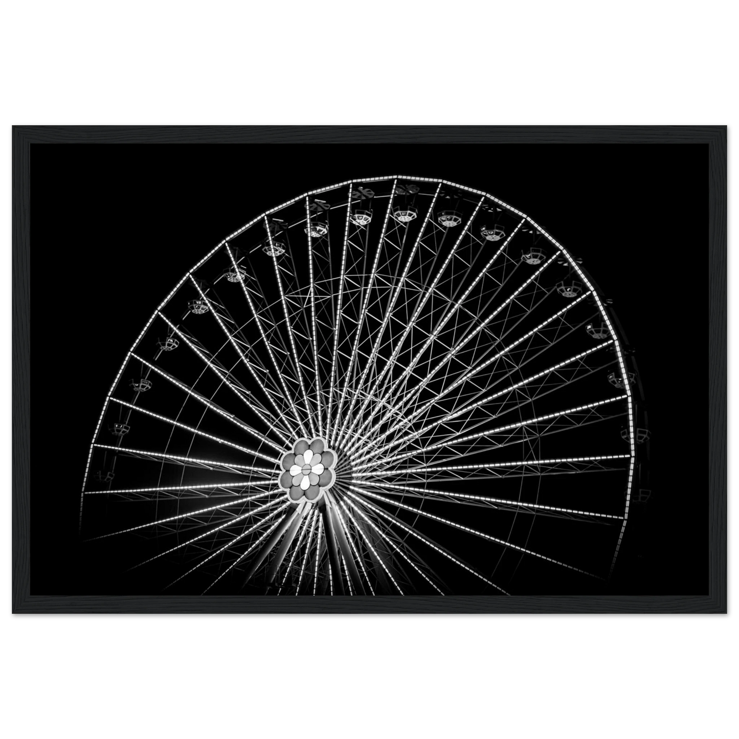 Black and white night photo of the Vienna Prater Giant Ferris Wheel (Wiener Riesenrad) with illuminated spokes forming a circular pattern against the dark sky on wooden framed wall art