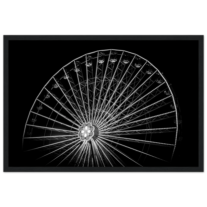 Black and white night photo of the Vienna Prater Giant Ferris Wheel (Wiener Riesenrad) with illuminated spokes forming a circular pattern against the dark sky on wooden framed wall art