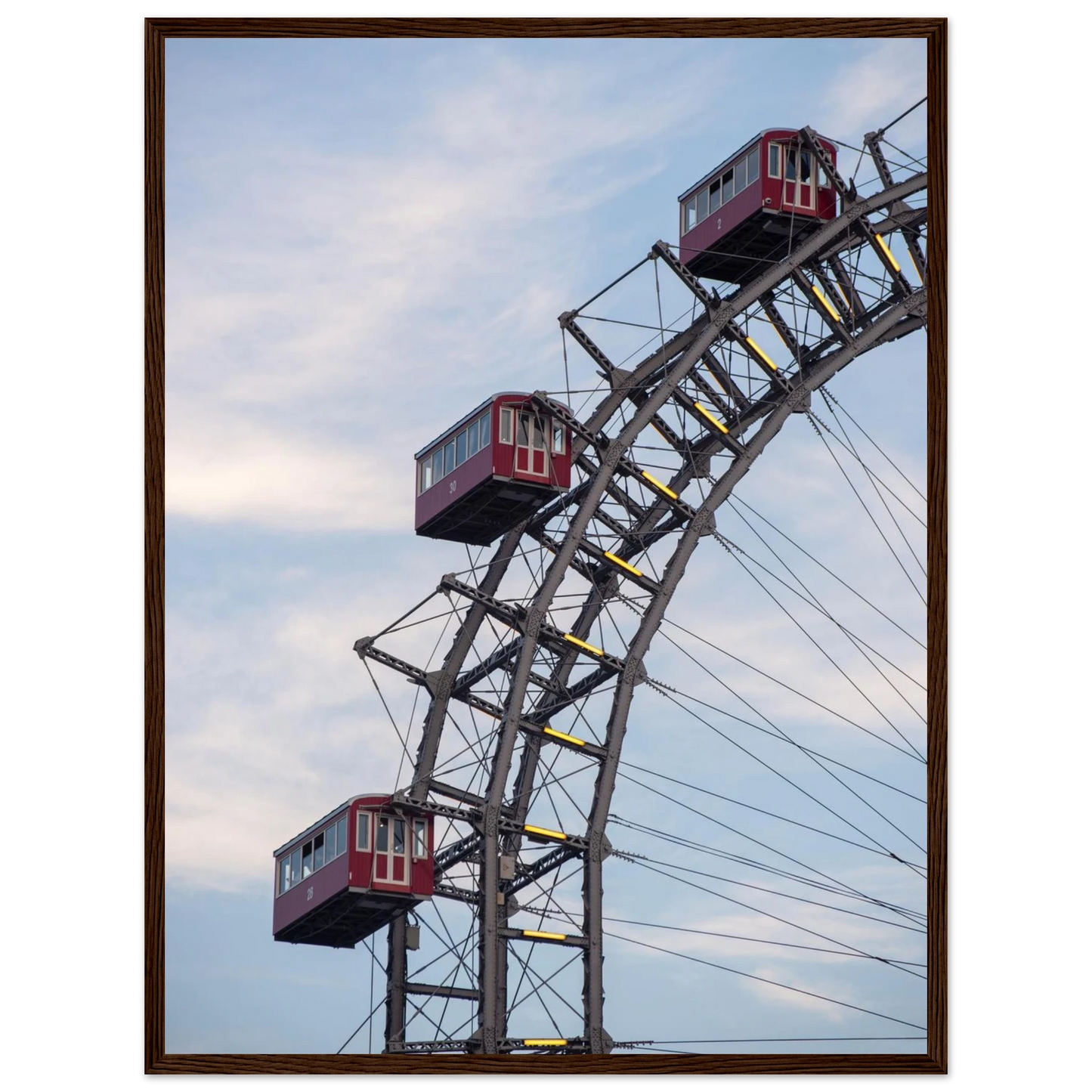 Close up of the historic Vienna Prater Giant Ferris Wheel (Wiener Riesenrad) showing its iconic steel structure and vintage mechanical details on wooden framed wall art