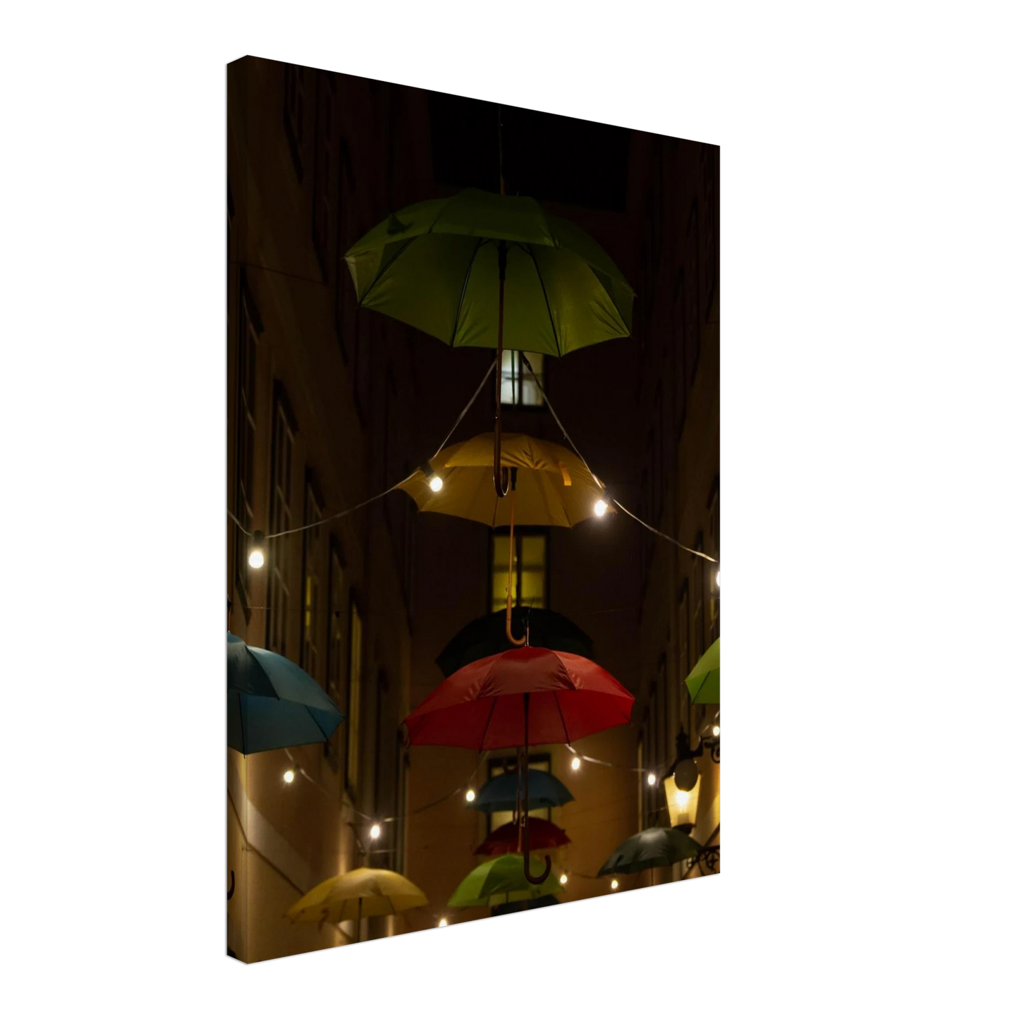 Nighttime street scene with colorful illuminated umbrellas hanging as decoration above a vibrant outdoor area on a Canvas print