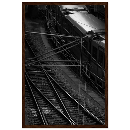 Black and white aerial view of metro train and railway tracks in an urban underground or elevated rail system on wooden framed wall art