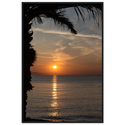 Wooden framed wall art Sunset over calm water with golden reflections, framed by tree branches in a peaceful natural landscape