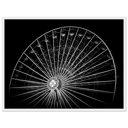Black and white night photo of the Vienna Prater Giant Ferris Wheel (Wiener Riesenrad) with illuminated spokes forming a circular pattern against the dark sky on wooden framed wall art