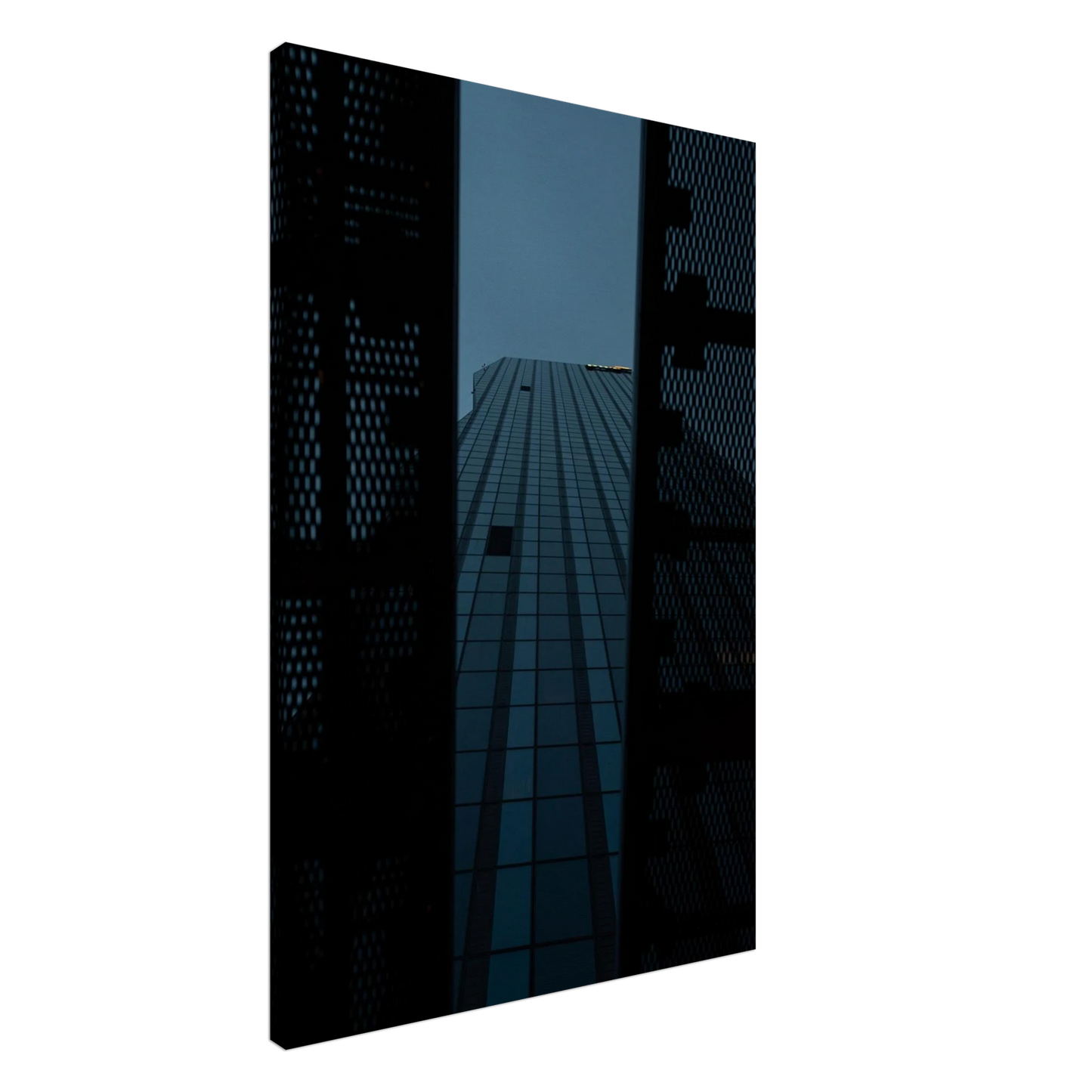 Low angle view looking up at a tall glass skyscraper framed between two metal structural elements on Canvas Print wall art