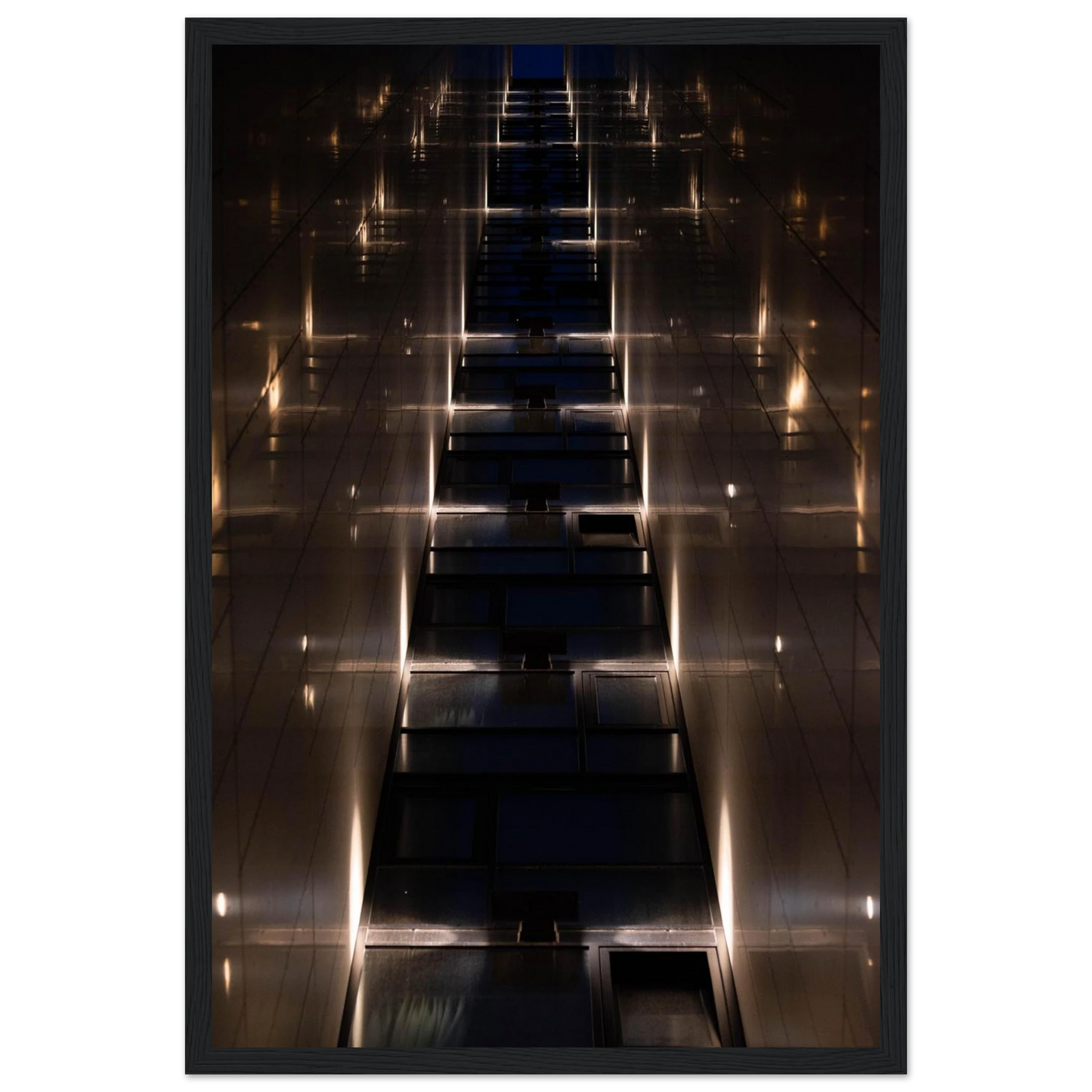 Low angle view looking up a narrow corridor-like passage between two skyscraper walls lined with rows of windows stretching toward the sky on wooden framed wall art