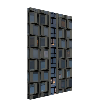 Close up view of a modern building facade with a grid of reflective glass windows on Canvas print wall art