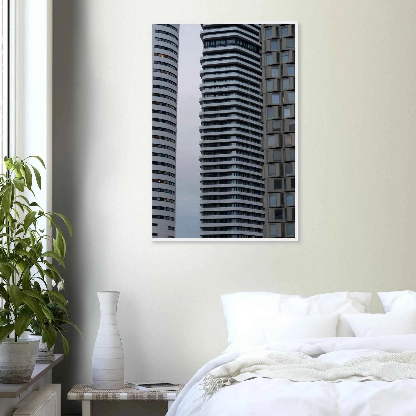 Modern high rise tower buildings with glass and steel facade reaching into the sky on wodden framed wall art on the wall in the Bedroom