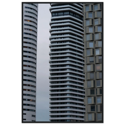 Modern high rise tower buildings with glass and steel facade reaching into the sky on wodden framed wall art