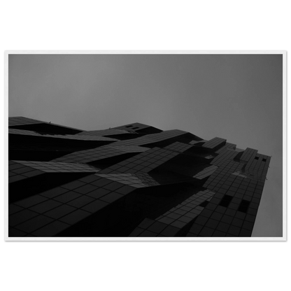 Black and white low angle view of a modern skyscraper with bold geometric lines and dark textured facade on wooden framed wall art