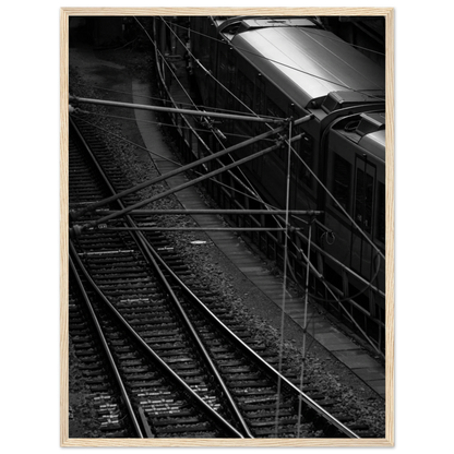 Black and white aerial view of metro train and railway tracks in an urban underground or elevated rail system on wooden framed wall art