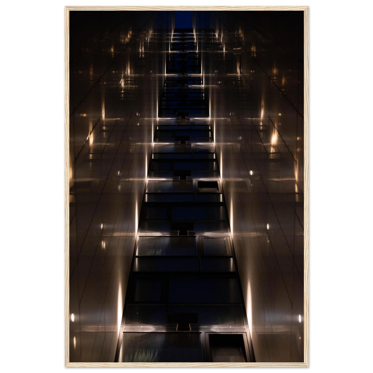 Low angle view looking up a narrow corridor-like passage between two skyscraper walls lined with rows of windows stretching toward the sky on wooden framed wall art