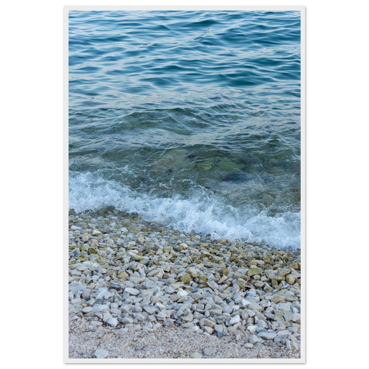 Aerial view ocean beach with wood frame, top down drone shot of blue sea foam and pebbles