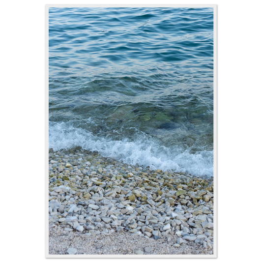 Aerial view ocean beach with wood frame, top down drone shot of blue sea foam and pebbles