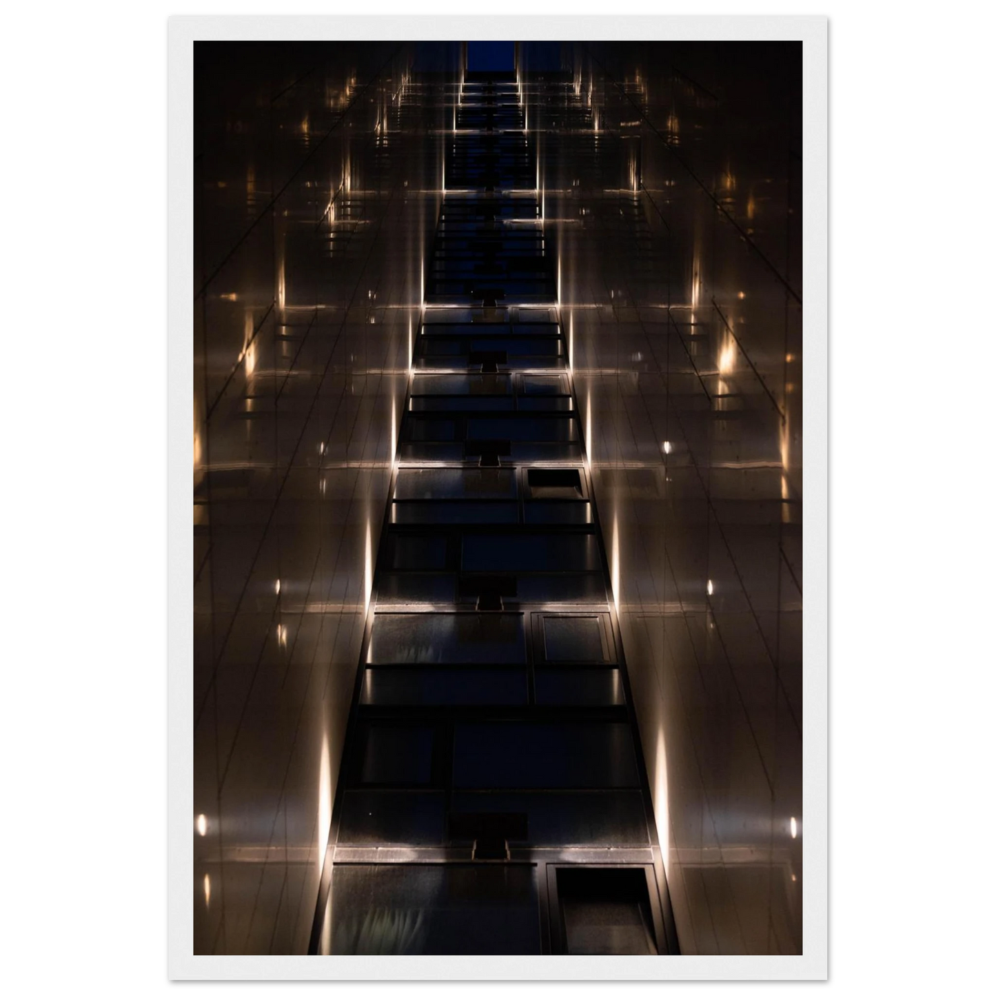 Low angle view looking up a narrow corridor-like passage between two skyscraper walls lined with rows of windows stretching toward the sky on wooden framed wall art