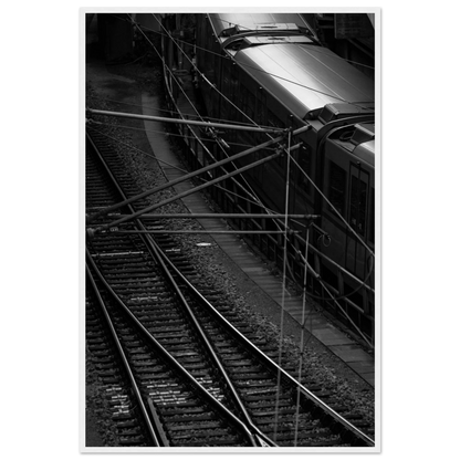 Black and white aerial view of metro train and railway tracks in an urban underground or elevated rail system on wooden framed wall art