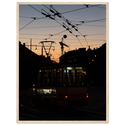 Wooden framed wall art featuring a tram the Nightline driving between houses under power lines during a golden sunset