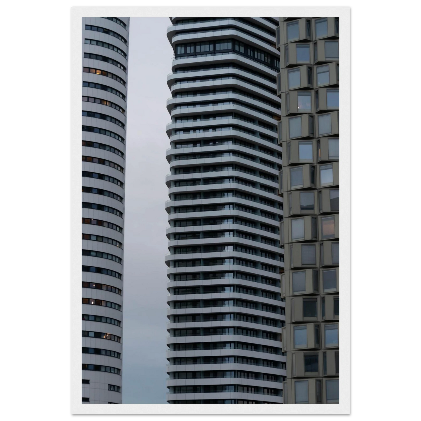 Modern high rise tower buildings with glass and steel facade reaching into the sky on wodden framed wall art
