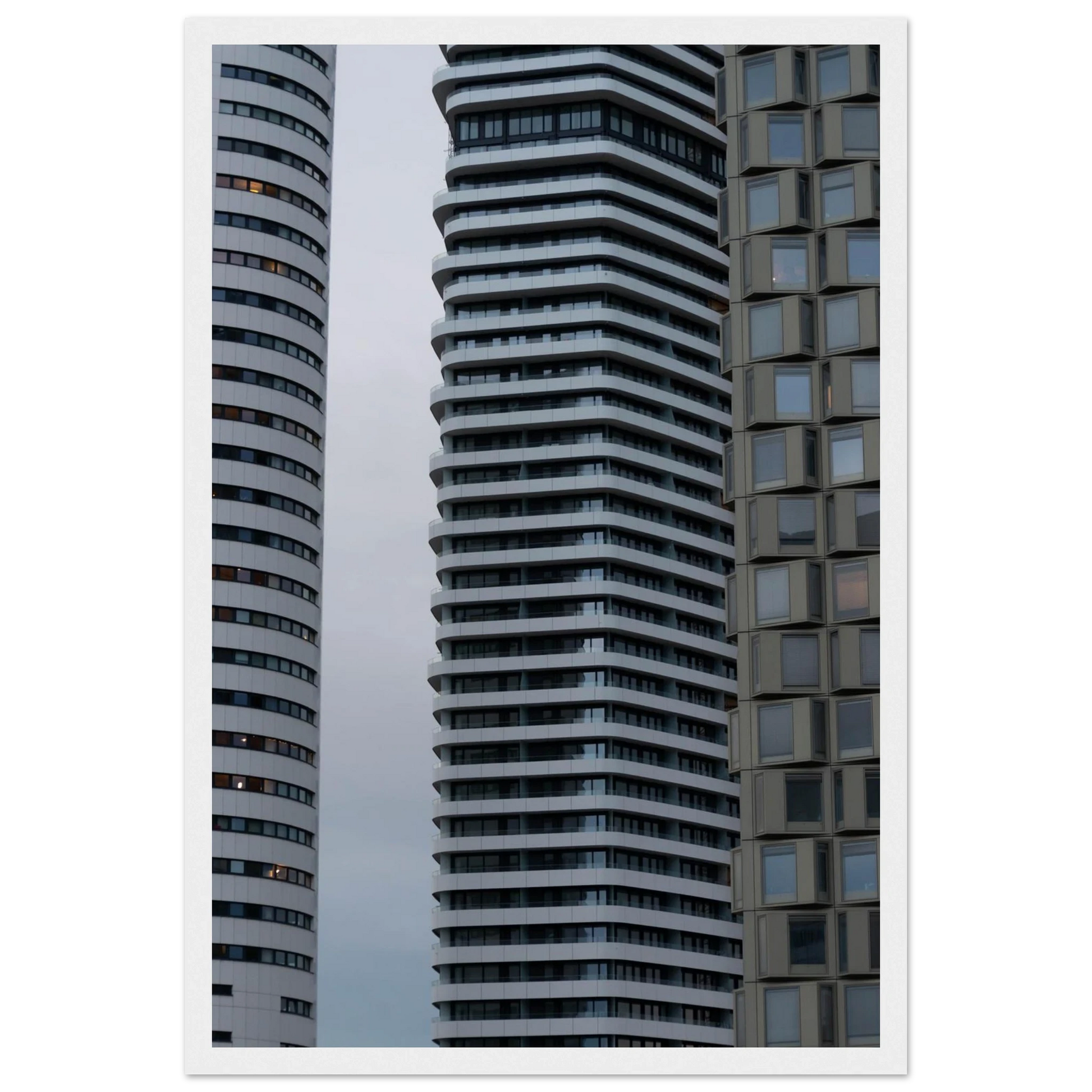 Modern high rise tower buildings with glass and steel facade reaching into the sky on wodden framed wall art
