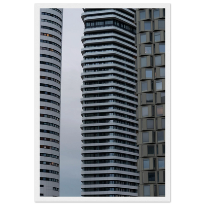 Modern high rise tower buildings with glass and steel facade reaching into the sky on wodden framed wall art