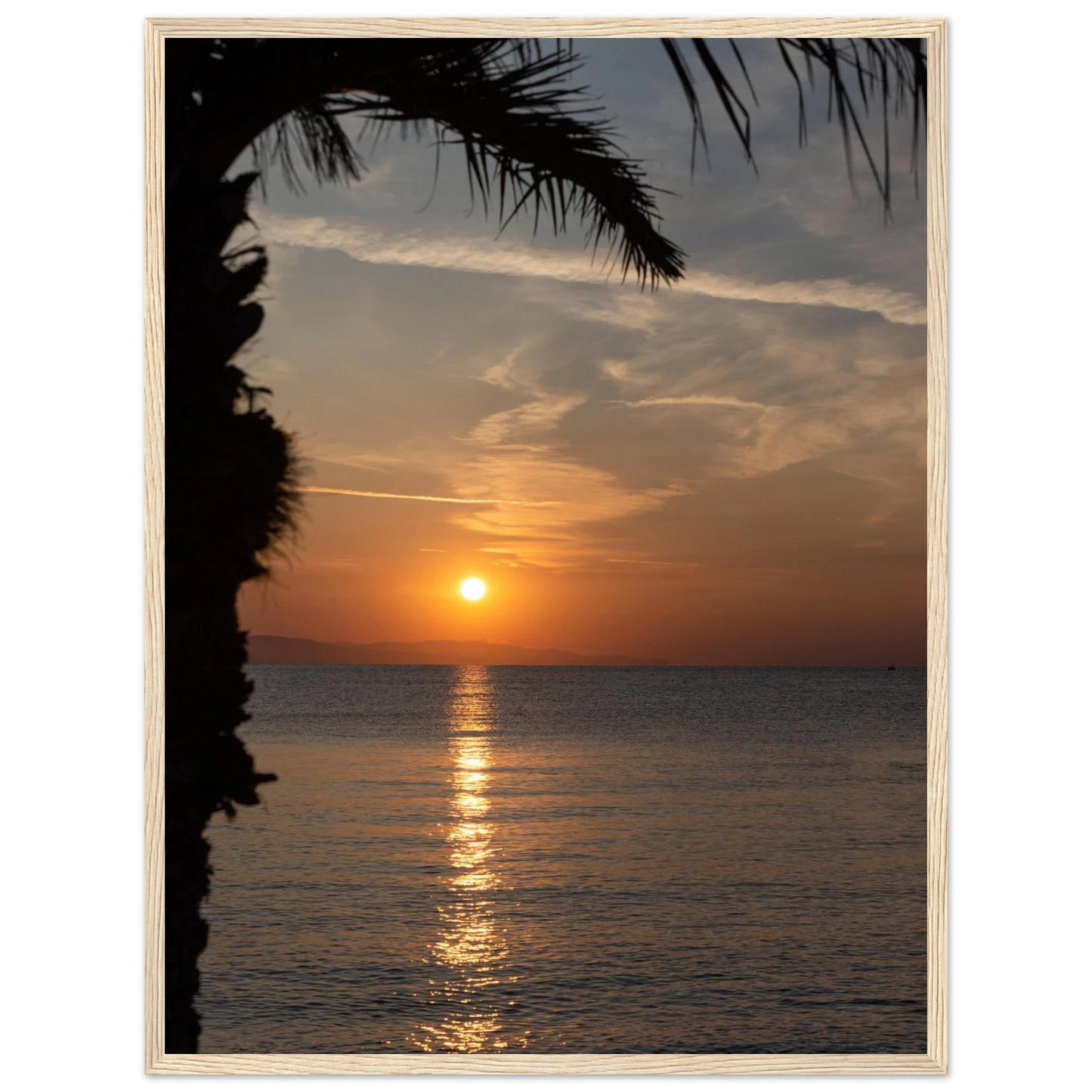 Wooden framed wall art Sunset over calm water with golden reflections, framed by tree branches in a peaceful natural landscape
