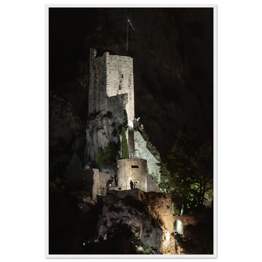 Wooden framed wall art of an ancient stone bastion decorated with green climbing plants against a dark background in Shadow Keep