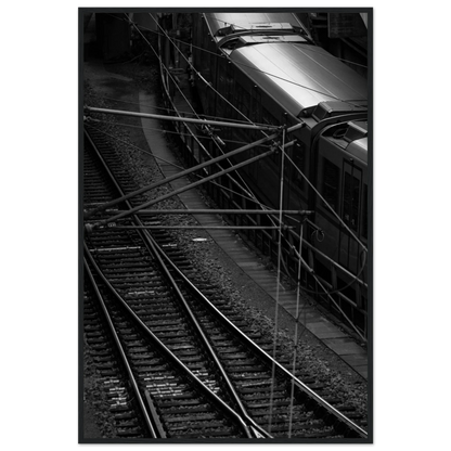 Black and white aerial view of metro train and railway tracks in an urban underground or elevated rail system on wooden framed wall art