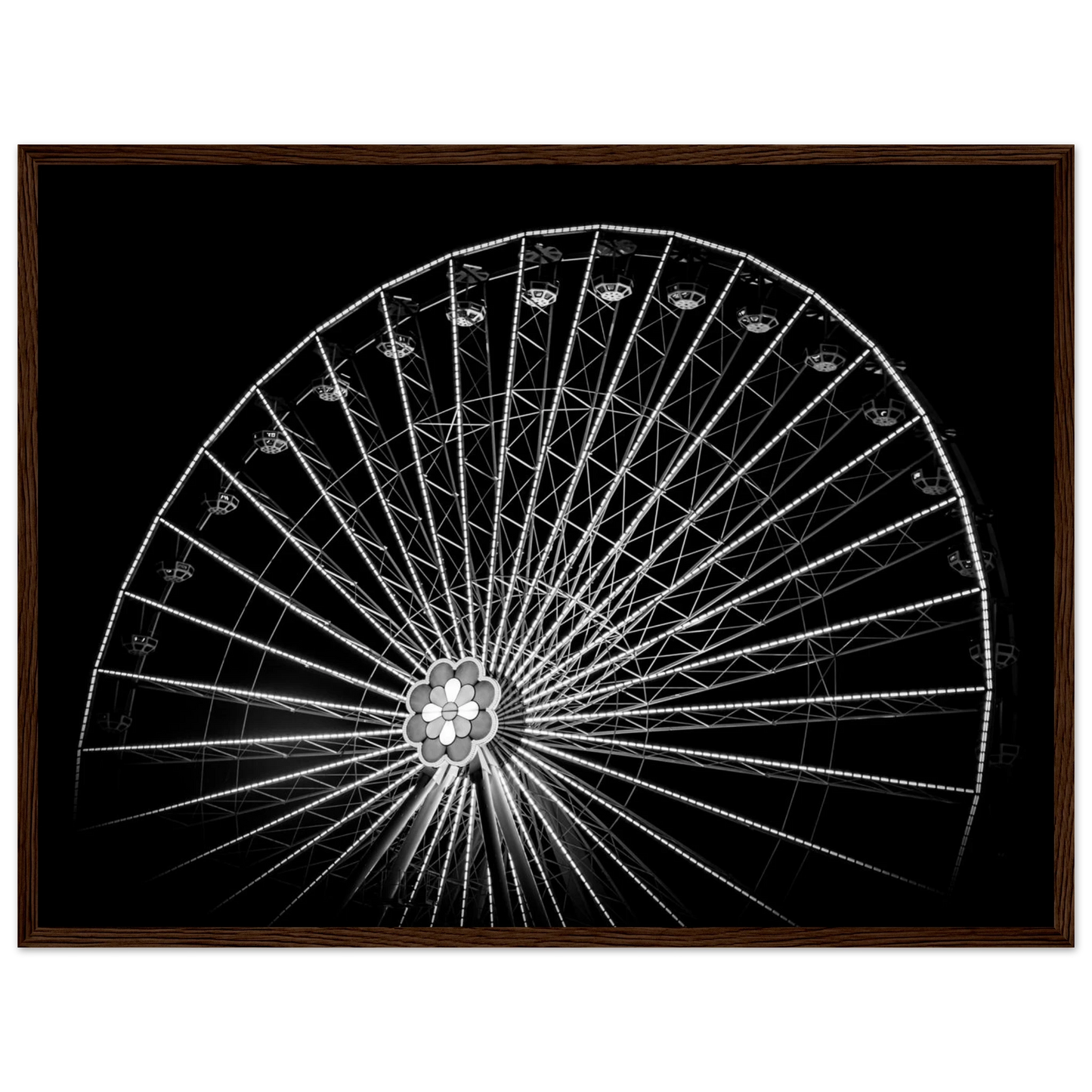 Black and white night photo of the Vienna Prater Giant Ferris Wheel (Wiener Riesenrad) with illuminated spokes forming a circular pattern against the dark sky on wooden framed wall art