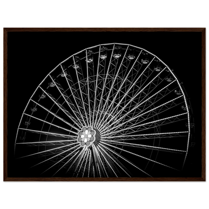 Black and white night photo of the Vienna Prater Giant Ferris Wheel (Wiener Riesenrad) with illuminated spokes forming a circular pattern against the dark sky on wooden framed wall art