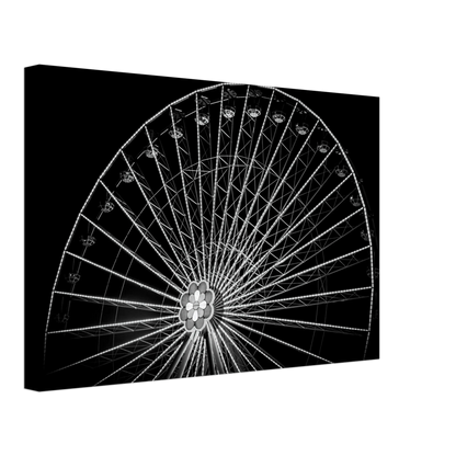 Black and white night photo of the Vienna Prater Giant Ferris Wheel (Wiener Riesenrad) with illuminated spokes forming a circular pattern against the dark sky on Canvas Print wall art