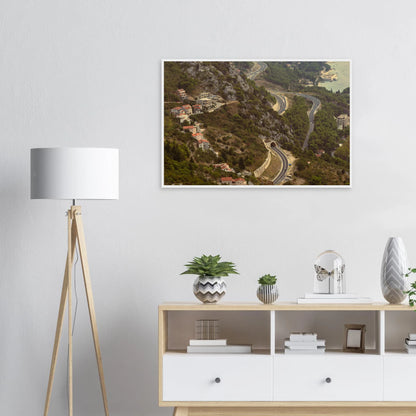 Classic, retro oil painting of a detailed landscape scene with lush trees, figures and rich natural surroundings on wooden framed wall art on the wall in the Livingroom