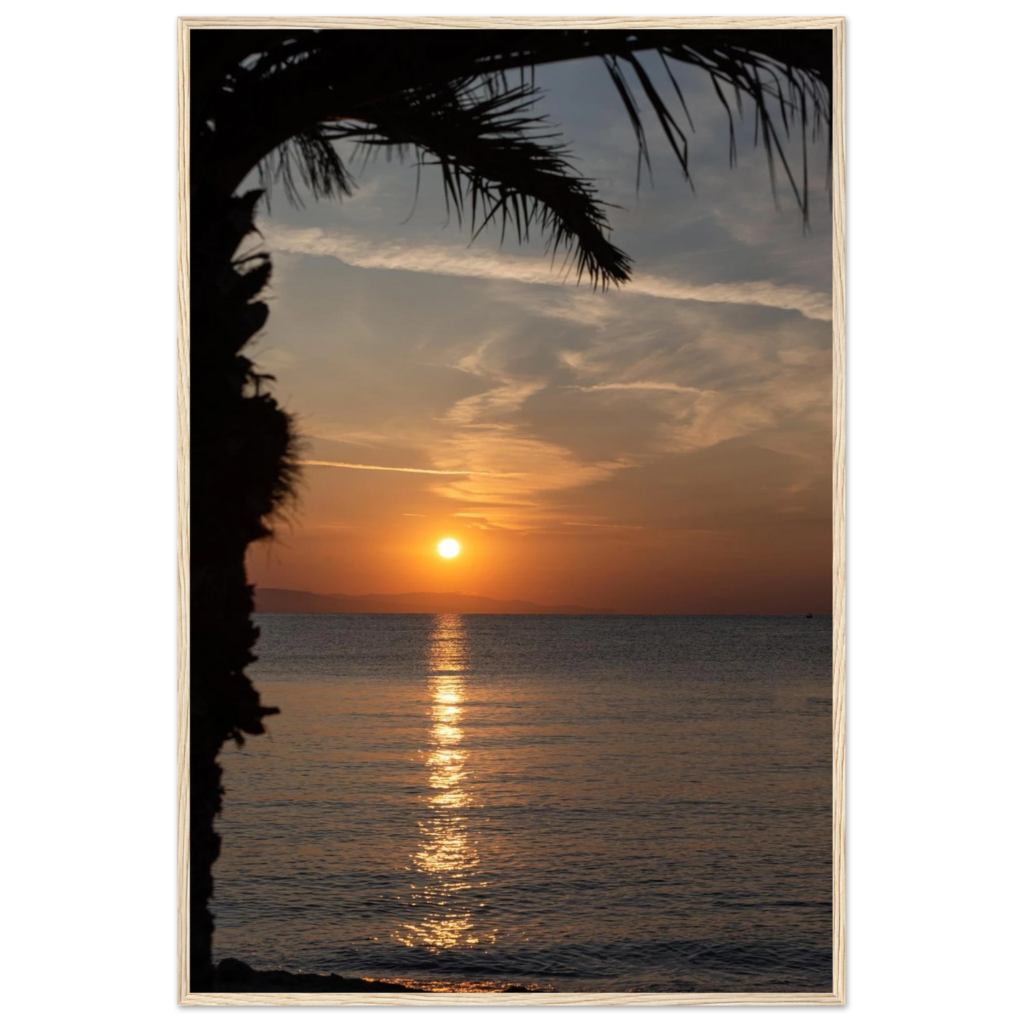 Wooden framed wall art Sunset over calm water with golden reflections, framed by tree branches in a peaceful natural landscape
