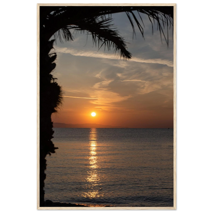 Wooden framed wall art Sunset over calm water with golden reflections, framed by tree branches in a peaceful natural landscape