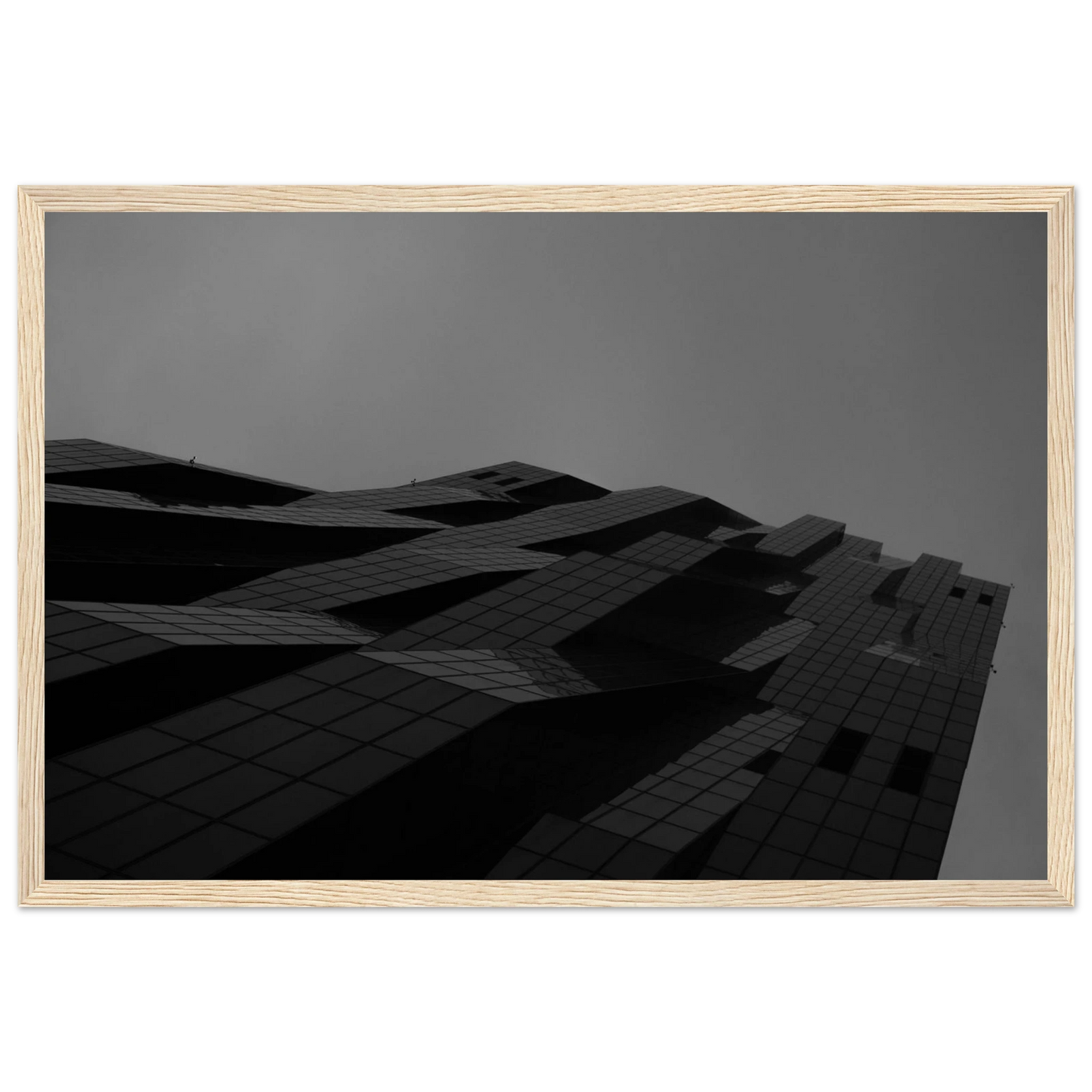 Black and white low angle view of a modern skyscraper with bold geometric lines and dark textured facade on wooden framed wall art