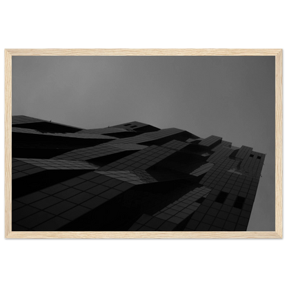 Black and white low angle view of a modern skyscraper with bold geometric lines and dark textured facade on wooden framed wall art